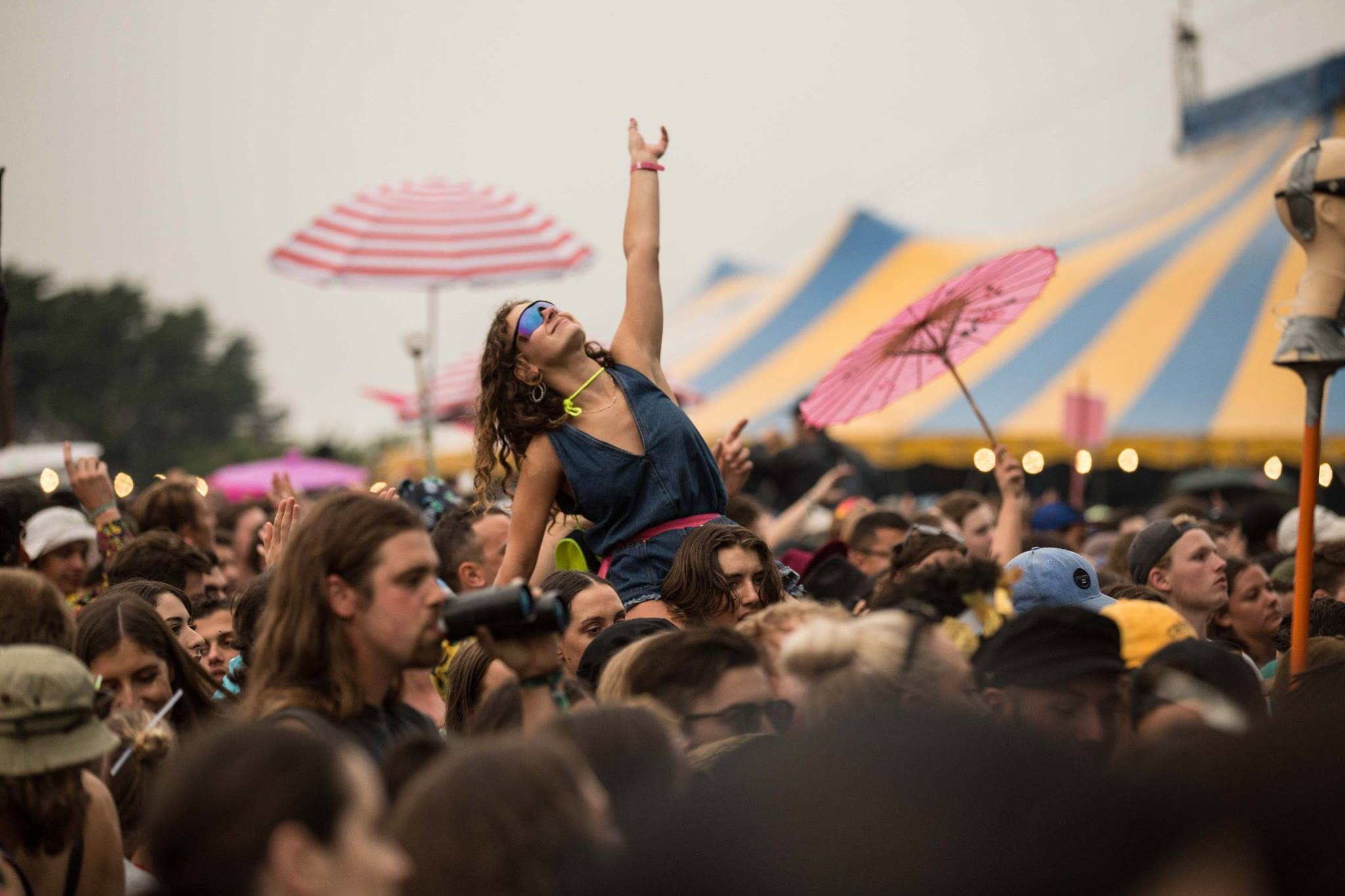 Girl on top of crowd at music festival